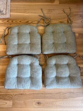 Pillow Perfect Tufted Seat Cushions in a Sage Seafoam color